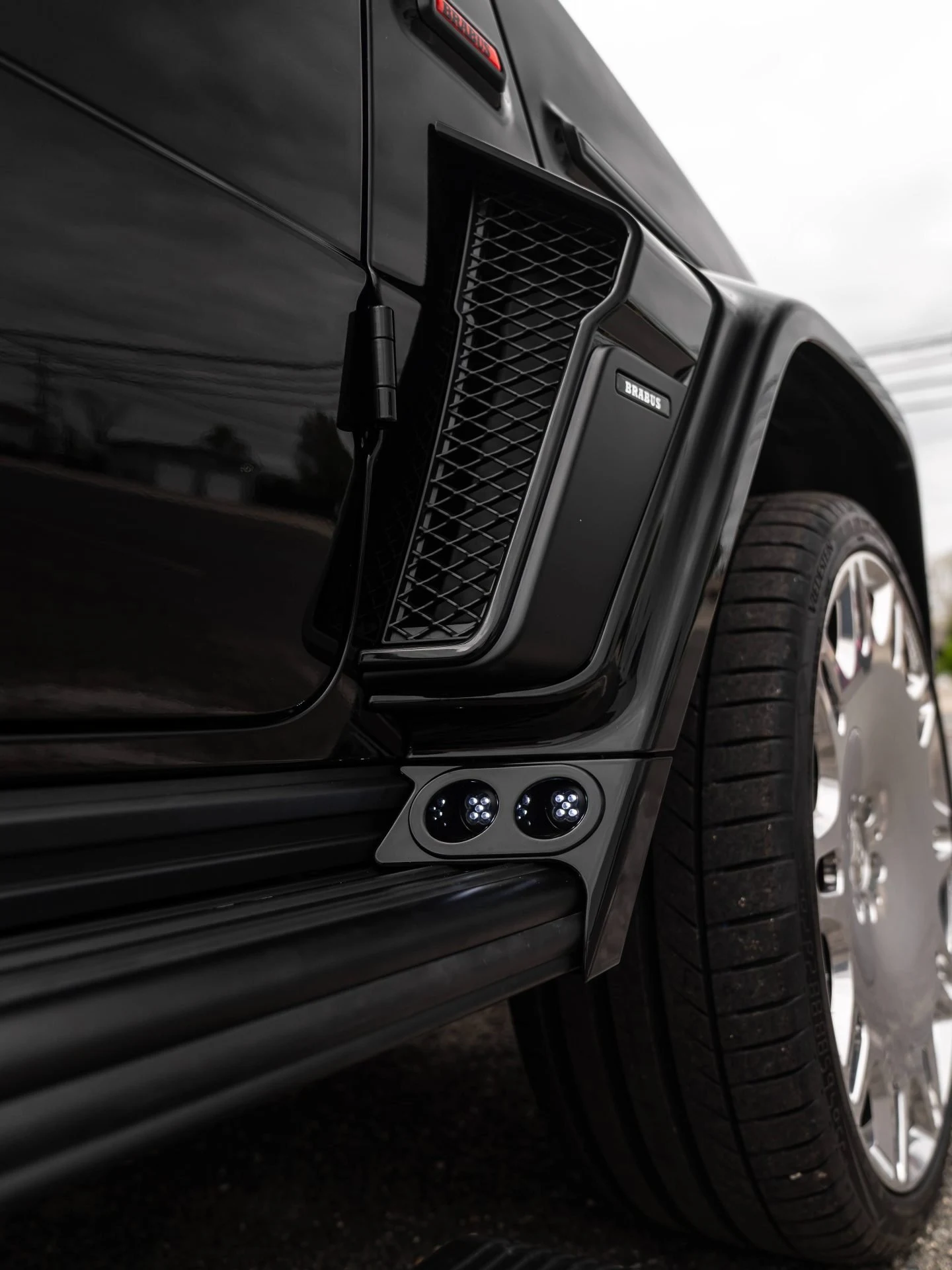 BRABUS badge on the fender of a black Mercedes-Benz G-Class