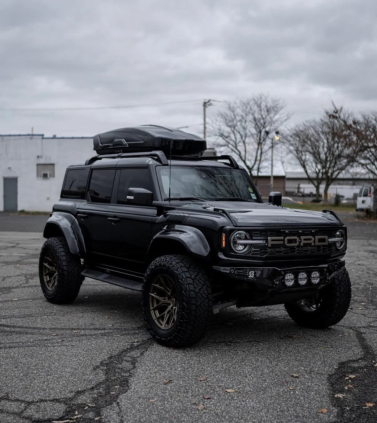 Ford Bronco exterior build with wide fenders, bronze wheels and auxiliary lighting